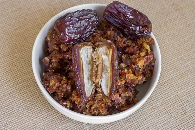 A bowl of pureed dates for making apple pie healthy oatmeal bars
