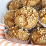 Pumpkin Spice Muffins made from cake mix sitting on orange napkin