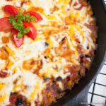 Burrito skillet in cast iron pan on cooling rack