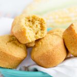 Up close picture of healthy cornbread muffin in blue bowl