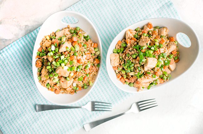 chicken fried rice in bowls with forks
