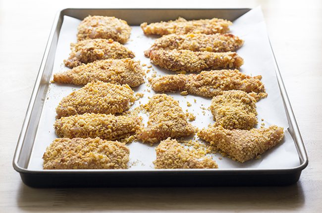 Crispy fried chicken recipe on baking sheet