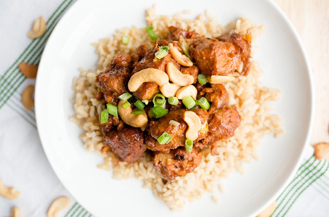 Overhead long image of a bowl of slow cooker cashew chicken