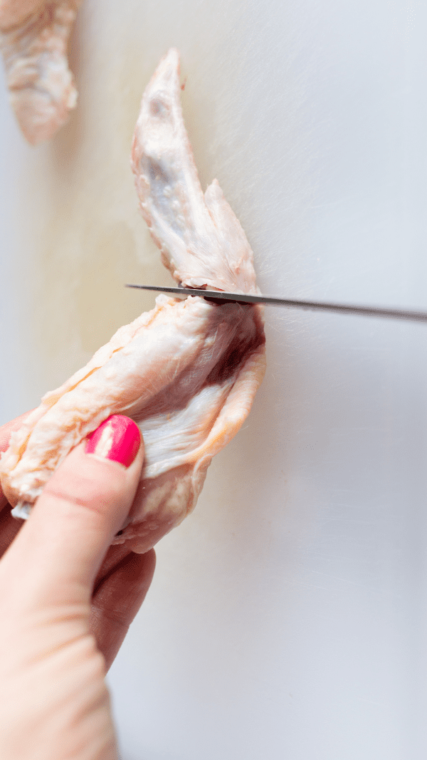 Cutting wing tips from chicken wings