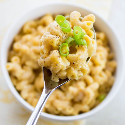 Up close picture of a large spoon of homemade healthy mac and cheese