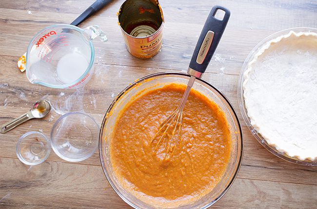 Pumpkin pie filling being mixed together for the healthy pumpkin pie