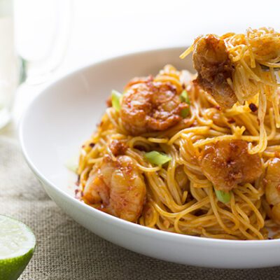 bang bang shrimp pasta in bowl with fork