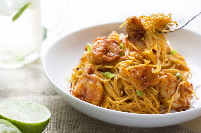 bang bang shrimp pasta in bowl with fork