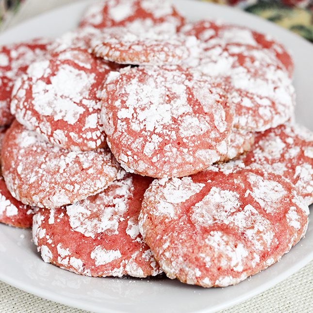 Up close image of strawberry cool whip cookies prepared on a white plate for serving