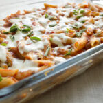 lasagna casserole baked in a casserole dish topped with cheese