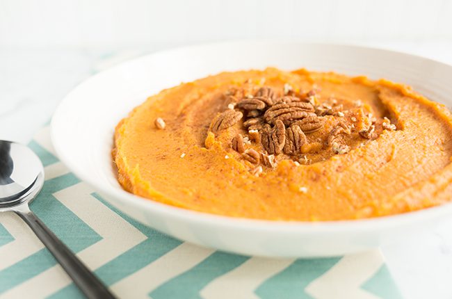 Image taken from the side of a bowl of mashed sweet potatoes