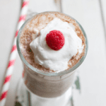 Raspberry mocha smoothie in glass with raspberry on top
