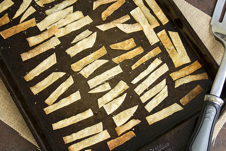 The Best Slow Cooker Chicken Tortilla Soup tortillas on baking sheet