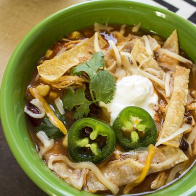 Up close picture of a bowl of chicken tortilla soup