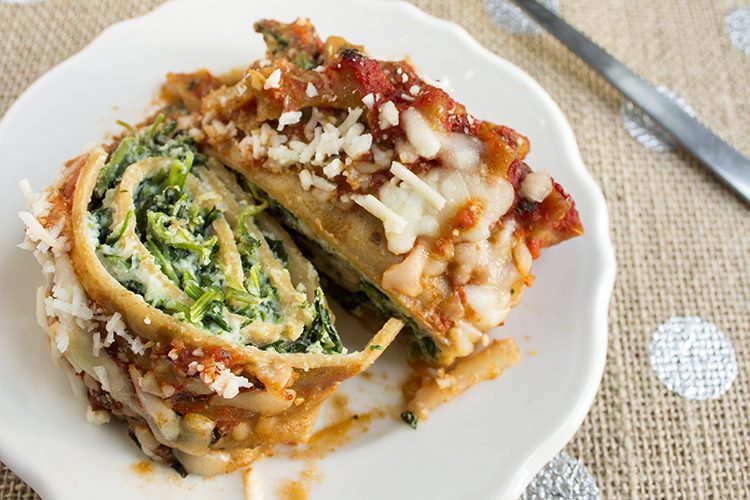 spinach lasagna roll ups on plate.