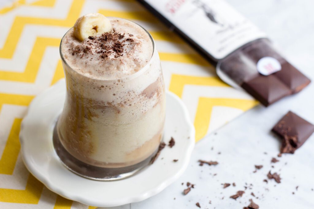 A glass of chocolate and banana protein smoothie