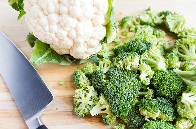 Broccoli and cauliflower on a cutting board