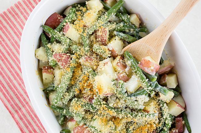 Overhead picture of a casserole dish filled with fresh green bean casserole topped with breadcrumbs