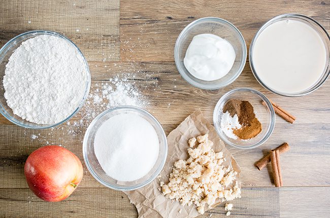 Ingredients for apple cinnamon muffins on table