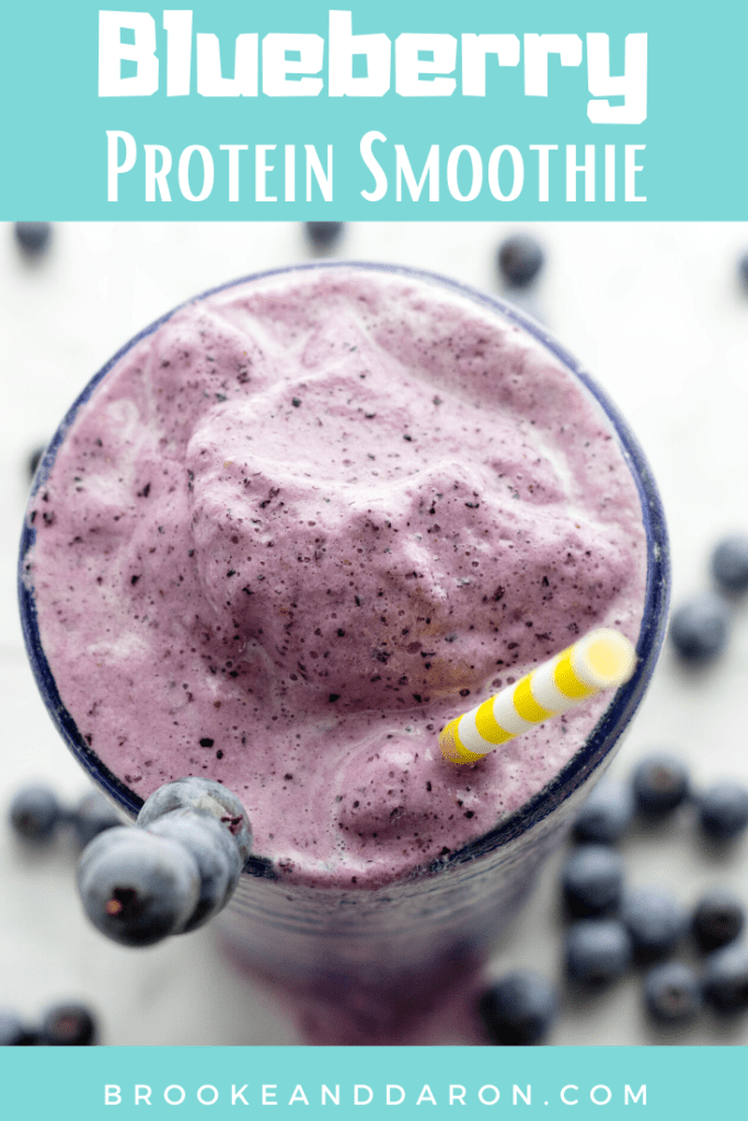 Overhead picture of a tall glass filled with a blueberry protein smoothie