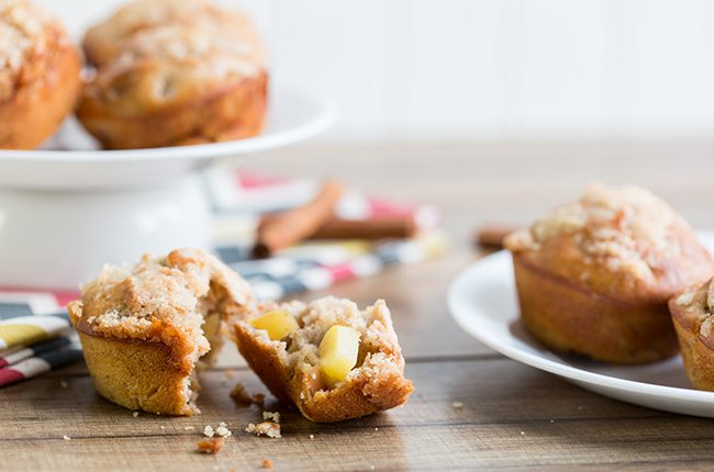 Picture taken from the side of a basket of apple muffins