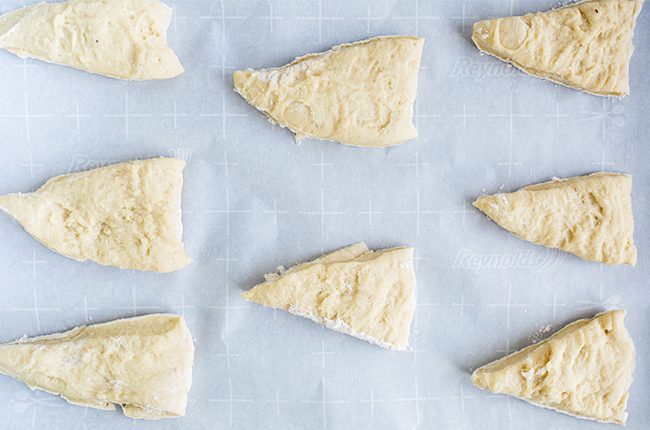 Slices of scones on baking sheet ready to bake