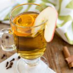 Square picture of a glass of hot apple cider