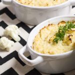 Square picture of mashed cauliflower in a white crock