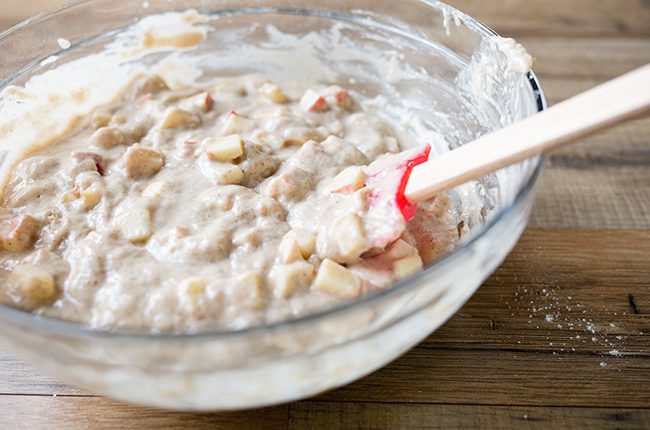 Stirring the batter for apple muffins recipe