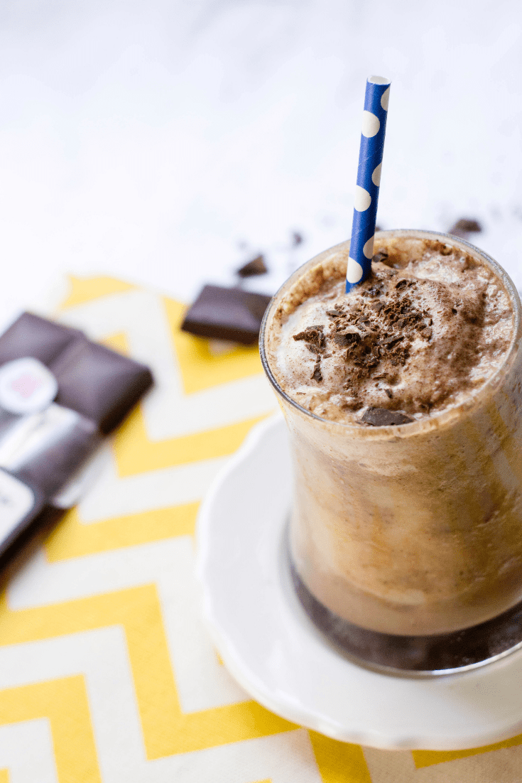Tall glass filled with chocolate banana protein shake recipe for breakfast