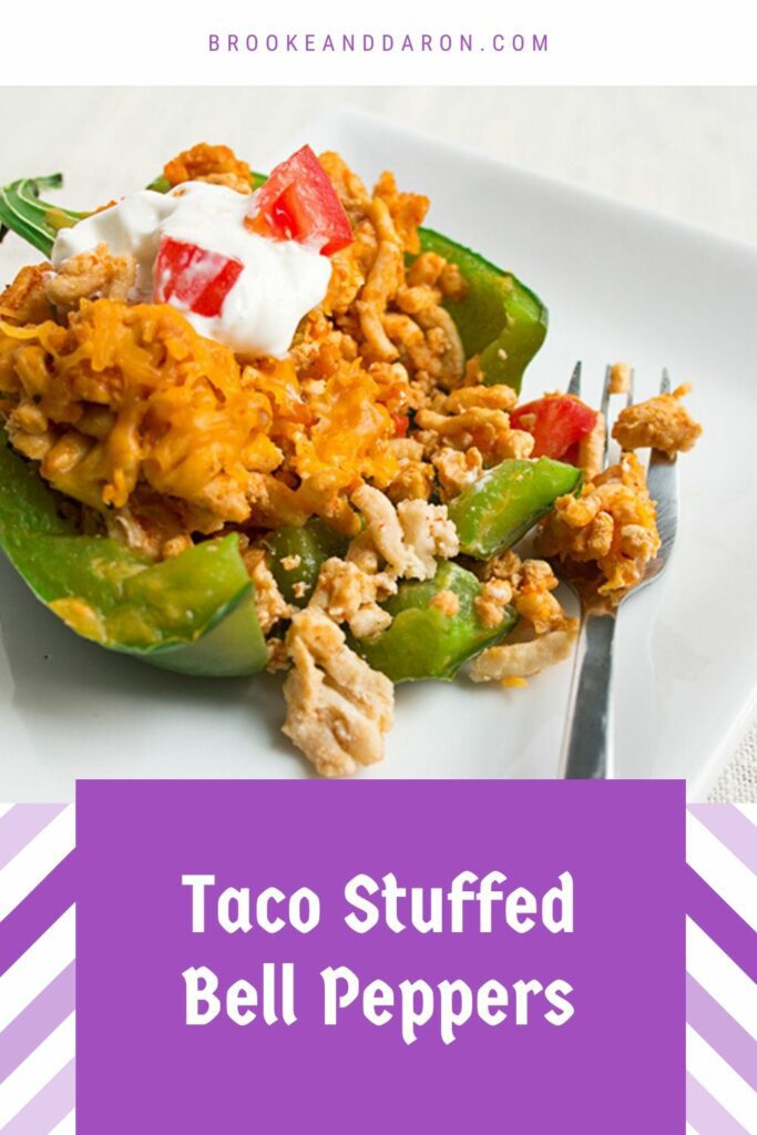 Single green bell pepper on white plate with fork