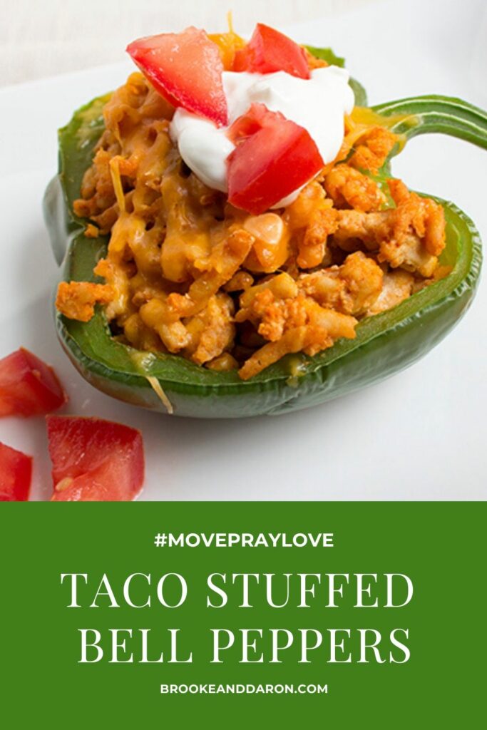 Single green bell pepper on white plate with fork