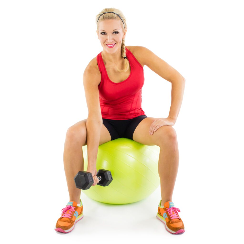 image of girl doing concentration curl on stability ball with dumbbell 