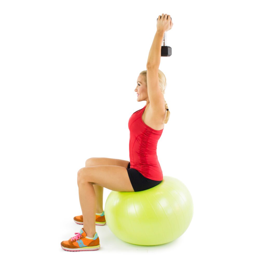 image of Brooke doing overhead tricep extension on stability ball