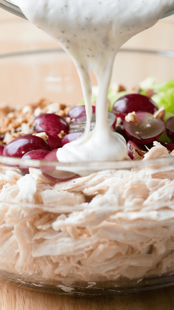Pouring the Dressing Healthy Chicken Salad with Grapes and Pecans