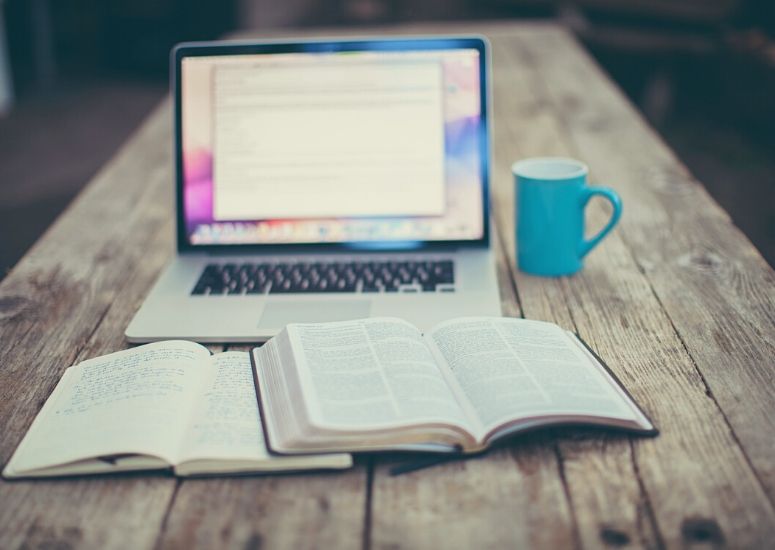 image of computer and bible for how to start reading and studying the bible 