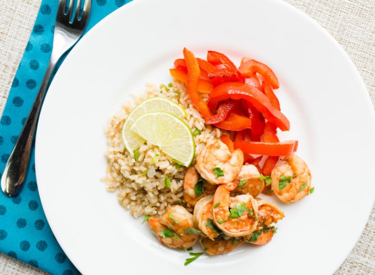 shrimp with brown rice plated