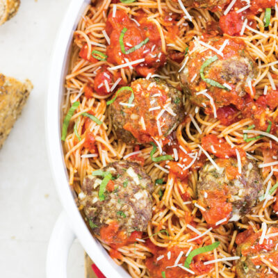 overhead vertical shot of spaghetti and meatballs in pan